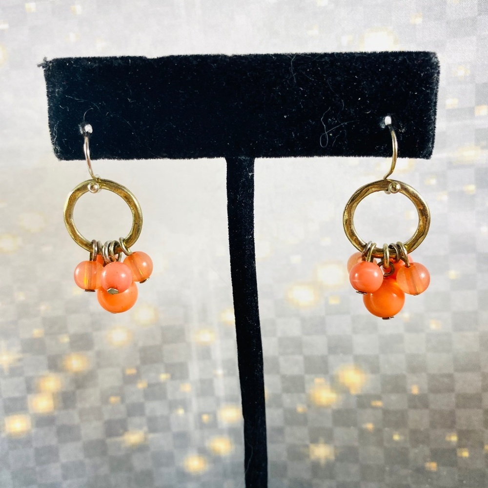 Itty Bitty little clusters of glass beads on little gold hoops.